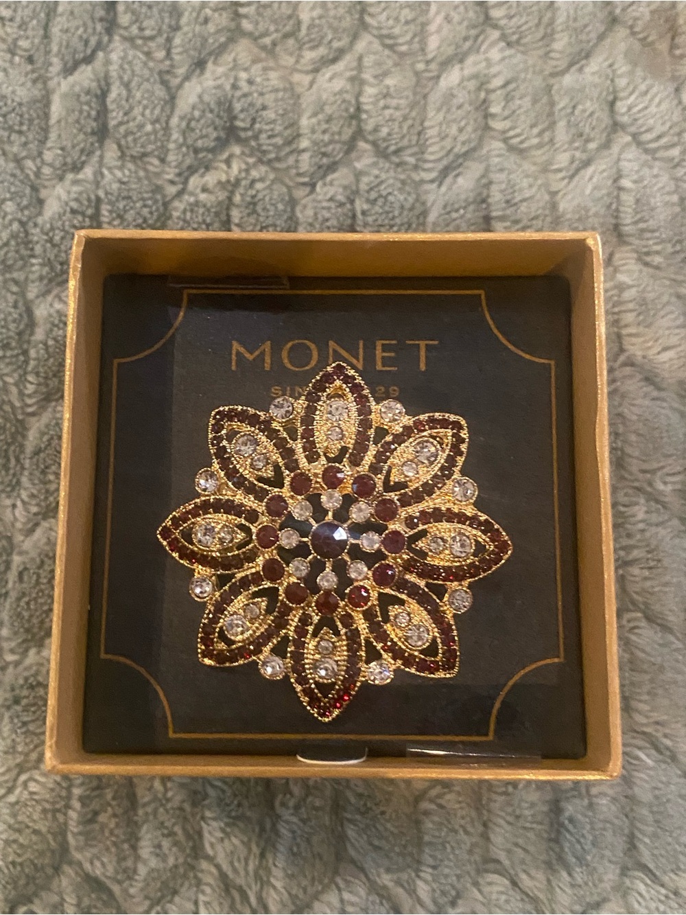 Monet Gold-Tone Floral Brooch with Red and Clear Stones